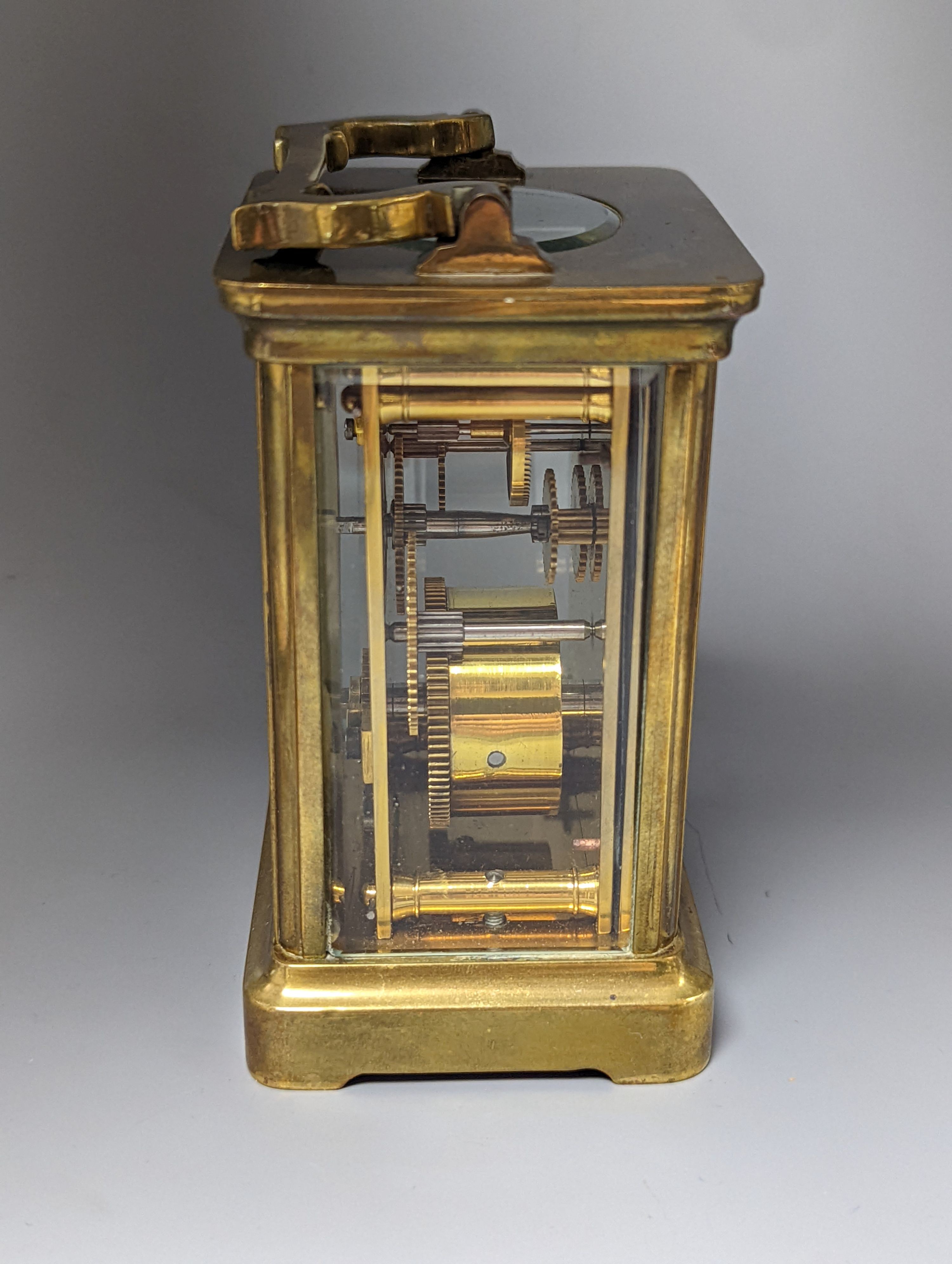 A French brass carriage timepiece, 14cm. including handle